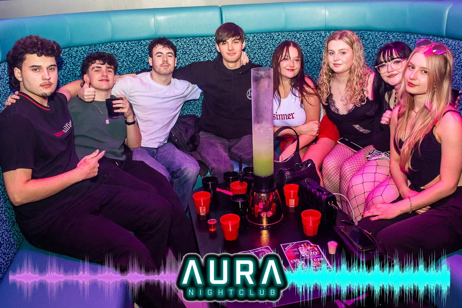 VIP booth experience with turquoise seating and bottle service